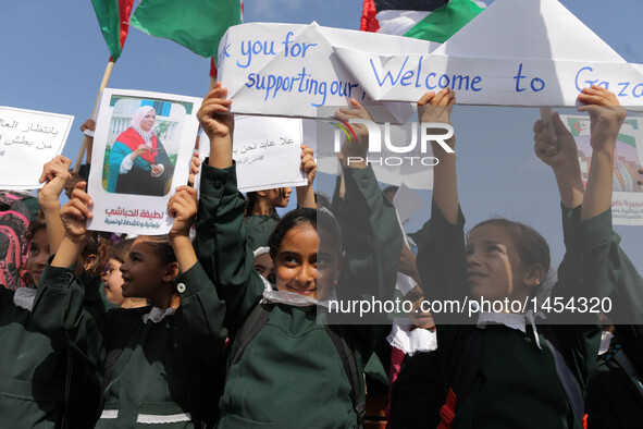 Palestinian girls take part in a rally in support of a Gaza-bound flotilla of international activists attempting to break the Gaza blockade,...