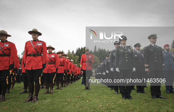 Police officers from different departments line up during the British Columbia Law Enforcement Memorial event in Vancouver, Canada, Sept. 25...