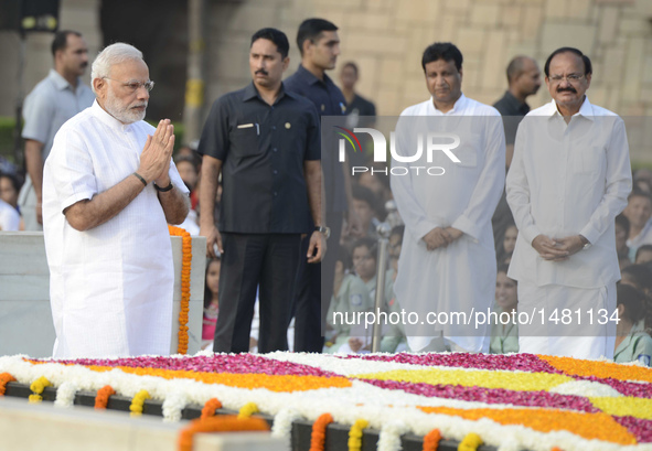 Indian Prime Minister Narendra Modi pays tribute to Mahatma Gandhi during a remembrance ceremony for his 147th birth anniversary at Rajghat...