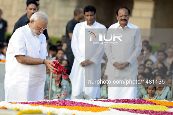 Indian Prime Minister Narendra Modi pays tribute to Mahatma Gandhi during a remembrance ceremony for his 147th birth anniversary at Rajghat...