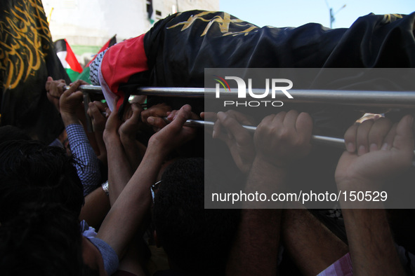 Ramallah, West Bank, Palestine: Palestinians carry the body of Mohammed Tarifi, 30, during his funeral in the West Bank city of Ramallah on...