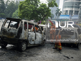 Aftermath of car engulfed in fire incident in Kuala Lumpur, Malaysia, Friday, June 20, 2014.(
