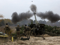 Ukrainian servicemen fire a 2A65 Msta-B howitzer during military exercises near the village of Divychky in Kyiv region, Ukraine, October 21,...