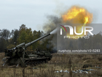  Ukrainian servicemen fire a 203mm self-propelled gun 'Pion' during a military exercise on the Devichki shooting range, about 85 km of capit...