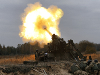  Ukrainian servicemen fire a 203mm self-propelled gun 'Pion' during a military exercise on the Devichki shooting range, about 85 km of capit...