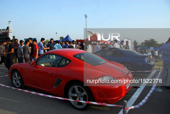 People visit a car show in Islamabad, capital of Pakistan on Oct. 23, 2016. The Islamabad Auto Show 2016, orchestrated by PakWheels, made a...