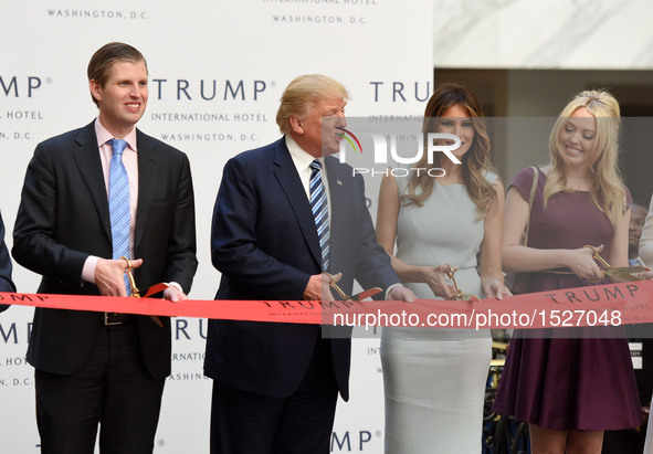 U.S. Republican presidential nominee Donald Trump (2nd L) and his family members cut the ribbon during the opening and ribbon cutting ceremo...