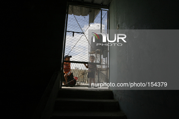 A Palestinian children in their home a near of the sea beach in the central Gaza Strip on June 26, 2014. Palestinian Environment Quality Aut...