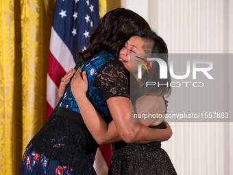 First Lady Michelle Obama hugs awardee, Bay Area Video Coalition, Next Gen (San Francisco, CA), at the 2016 National Arts and Humanities You...