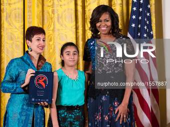 First Lady Michelle Obama (right), poses for a photo with awardee, Sphinx Organization, Sphinx Overture (Detroit, MI), at the 2016 National...