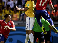 Fred (9) and Gary Medel (17) at the match #49, for the Round of 16, of the 2014 World Cup, between Brazil and Chile, this saturday, June 28t...