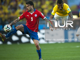 Belo Horizonte BRAZIL--28 June: Pinilla and Luyiz Gustavo in the match between Brazil and Chile, correspondind at the round of last 16 of th...
