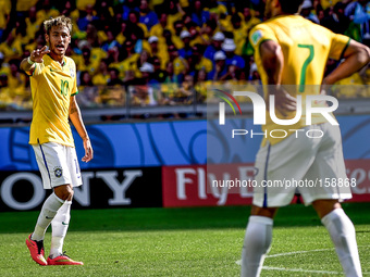 Neymar (10) speaks with Hulk (7) at the match #49, for the Round of 16, of the 2014 World Cup, between Brazil and Chile, this saturday, June...
