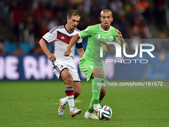 PORTO ALEGRE, 30.06.2014: BRAZIL: Philipp Lahm and Feghouli in match between Germany and Algeria, corresponding to the round of the last 16...