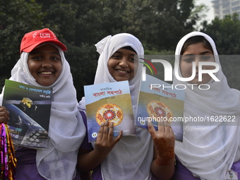 Bangladeshi School students rise up textbook during the Textbook Festival Day in Dhaka, Bangladesh. On January 01, 2017
 ‘Textbook Festival...