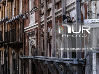 A damaged building with scaffolding, in L'Aquila, on July 2, 2014. (