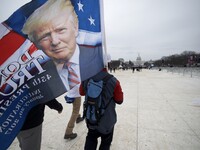 Protests and supporters gather as Donald Trump takes the oath of office and becomes the 45th President of the United States, during the Janu...
