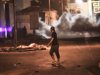 Bahrain , Abu Saiba - clashes in Abu Saiba village west of the capital Manama , riot police used tear gas and birds bullets widely against t...