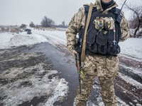Soldier of the ukrainian army in a checkpoint in the entrance to Troitske, one of the closest village to the combat frontlines in the war in...