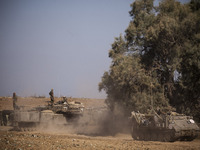 Israeli forces gather at a staging point on the border with Gaza on July 10th, 2014, in preparation for an imminent ground operation as the...