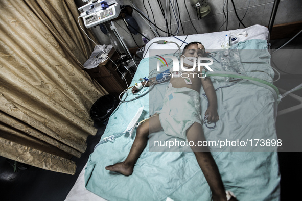 A injured child into a hospital in Gaza City after an Israeli airstrike, on July 10, 2014. The Palestinian death toll has risen to 88 as Isr...