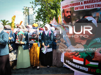 SEMARANG, INDONESIA - JULY 11: Indonesian muslims protest the airstrikes of Israel to Gaza in Semarang, Central Java, Indonesia on July 11,...