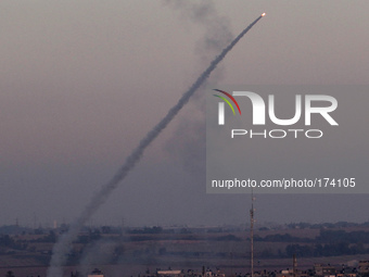An M75 rocket is launched from the Gaza strip into Israel by militants of Ezz Al-Din Al Qassam militia, the military wing of Hamas movement,...
