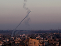 An M75 rocket is launched from the Gaza strip into Israel by militants of Ezz Al-Din Al Qassam militia, the military wing of Hamas movement,...