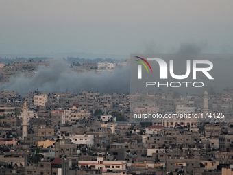 Smoke rises after an Israeli attack on Gaza City, 11 July 2014. (