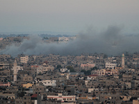 Smoke rises after an Israeli attack on Gaza City, 11 July 2014. (
