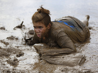 Israeli teenagers crawl with heavy sandbags through mud as they take part in an annual combat fitness training competition in preparation fo...