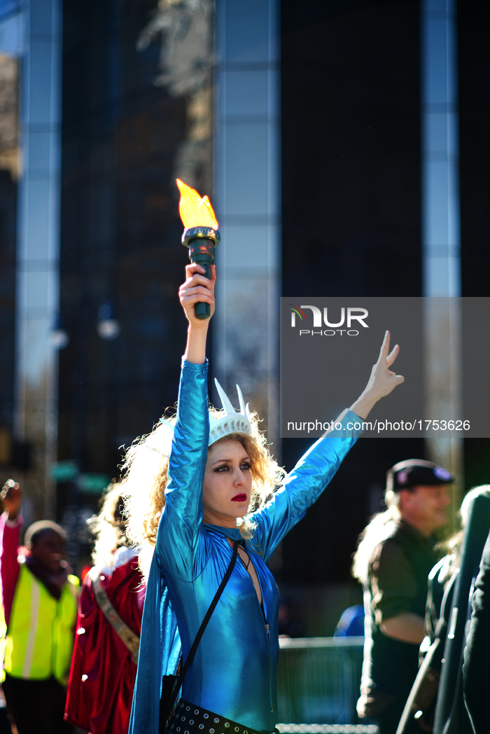 ‘Lady Liberty’ dances during the ‘Not My President’s Day’ rally near Trump International Hotel and Tower, at Central Park West, New York Cit...