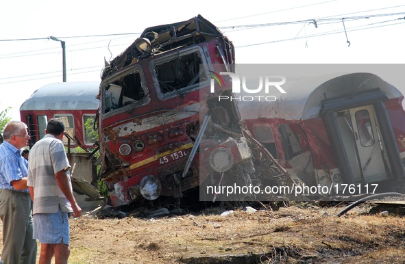 Bulgarian police officers and rescue workers attend near train crash near the village of Kalojanovec east of the Bulgarian capital Sofia, Su...