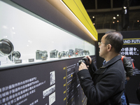 A visitor looking at Nikon cameras at the Nikon booth at the CP+ Camera and Photo Imaging Show in Yokohama, Kanagawa, Japan, on Thursday, Fe...