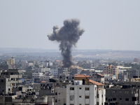  Smoke rises after an Israeli missile strike in Gaza City, Tuesday, July 15, 2014. The Israeli military says it has resumed airstrikes on Ga...