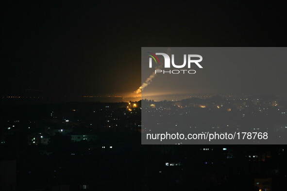 A photo taken on July 16, 2014 from the southern Israeli Gaza border shows Israeli army flares falling into the Palestinian enclave. 