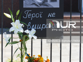 KIEV, UKRAINE - JULY 16: Flowers and the sheet with portrait of Valeriya Novodvorskaya with inscription 