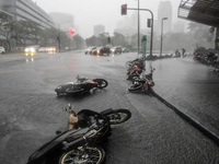 Makati City, Philippines - Motorcycles lie on the road toppled by strong winds as Typhoon Rammasun hit Metro Manila on July 16, 2014. Typhoo...