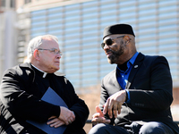 Archbishop Charles Chaput (left) is seen on stage as Interfaith Church and Community leaders are joined by local elected officials at a Marc...