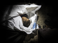 The body of four boys from Baker family killed in an Israeli strike, in Gaza, on July 16, 2014.(