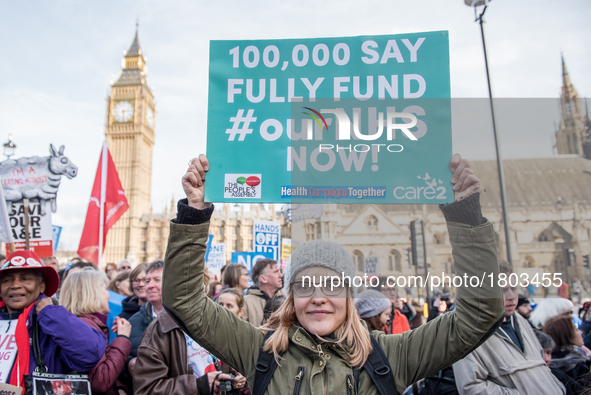  A protester holds up a placard during a demonstration in support of the NHS in Tavistock Square on March 4, 2017 in London, England. Thousa...