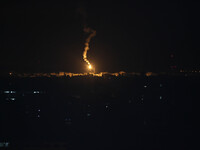 An Israeli army flare illuminating the sky above the Gaza strip on July 18, 2014. Israeli air strikes in Gaza killed four children, medics s...