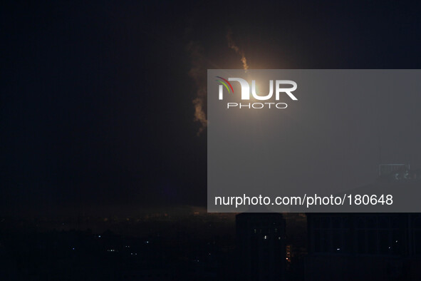 An Israeli army flare illuminating the sky above the Gaza strip on July 18, 2014. Israeli air strikes in Gaza killed four children, medics s...