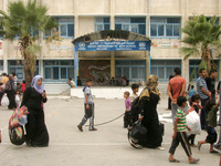 Palestinians inside the UNRWA school as they flee their houses following an Israeli ground offensive in Rafah in the southern Gaza Strip on...