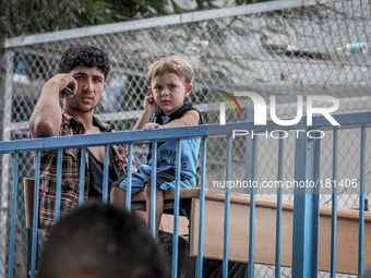 Palestinian people inside United Nations Relief and Works Agency (UNRWA) on July 18, 2014 in Gaza City. Israel launched a Gaza ground campai...
