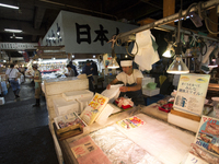 TOKYO, Japan A Tsukiji Fish Employer sets fish as the customers are coming at Tsukiji Fish Market on july 7, 2014. The Tsukiji fish market l...