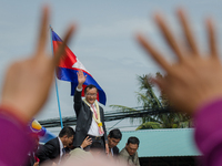 Sam Rainsy, president of Cambodia National Rescue Party, greets to his supporters upon his arrival in Phnom Penh on 19, July 2014. Sam Rains...