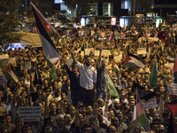 Protesters waved Palestinian flags and chanted during a protest outside the Israeli Consulate in Istanbul on July 19, 2014. Thousands of peo...
