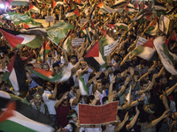 Protesters waved Palestinian flags and chanted during a protest outside the Israeli Consulate in Istanbul on July 19, 2014. Thousands of peo...