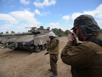 UNSPECIFIED, ISRAEL - JULY 19, 2014: Israeli reserve soldiers are smoking cigarettes in an army deployment area near Israel's border with th...